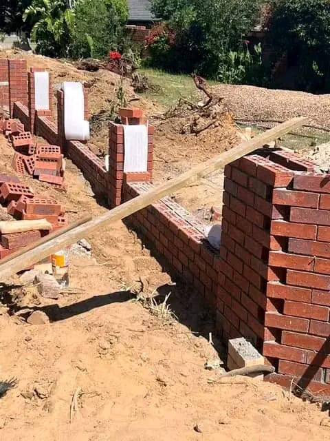 Retaining wall brickwork on a sloped site