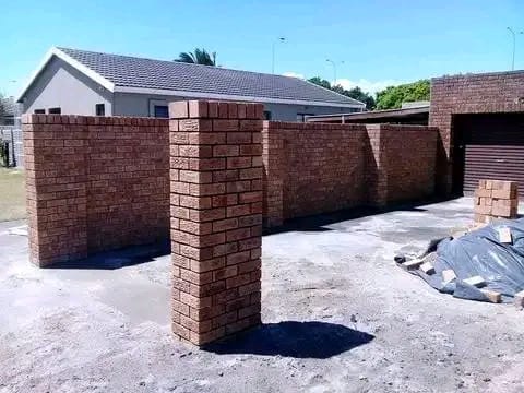Completed face brick boundary wall with pillars