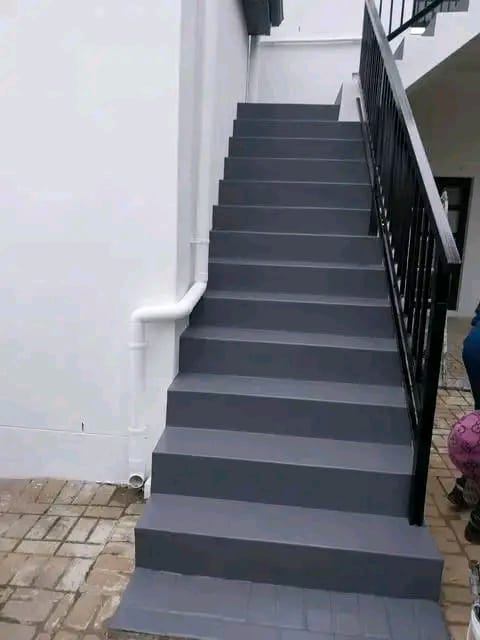 Exterior staircase finished and painted charcoal